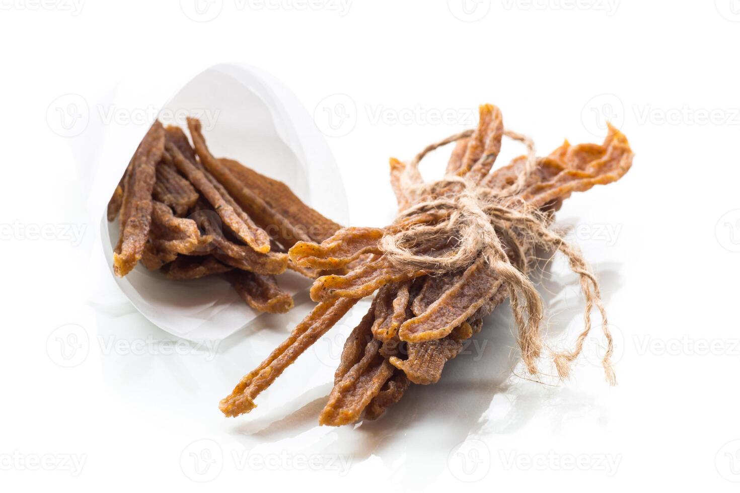 A handful of dried chicken meat, marinated with spices. photo