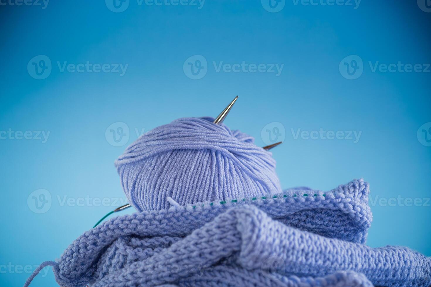 Set for hand knitting, blue yarn, knitting needles. photo