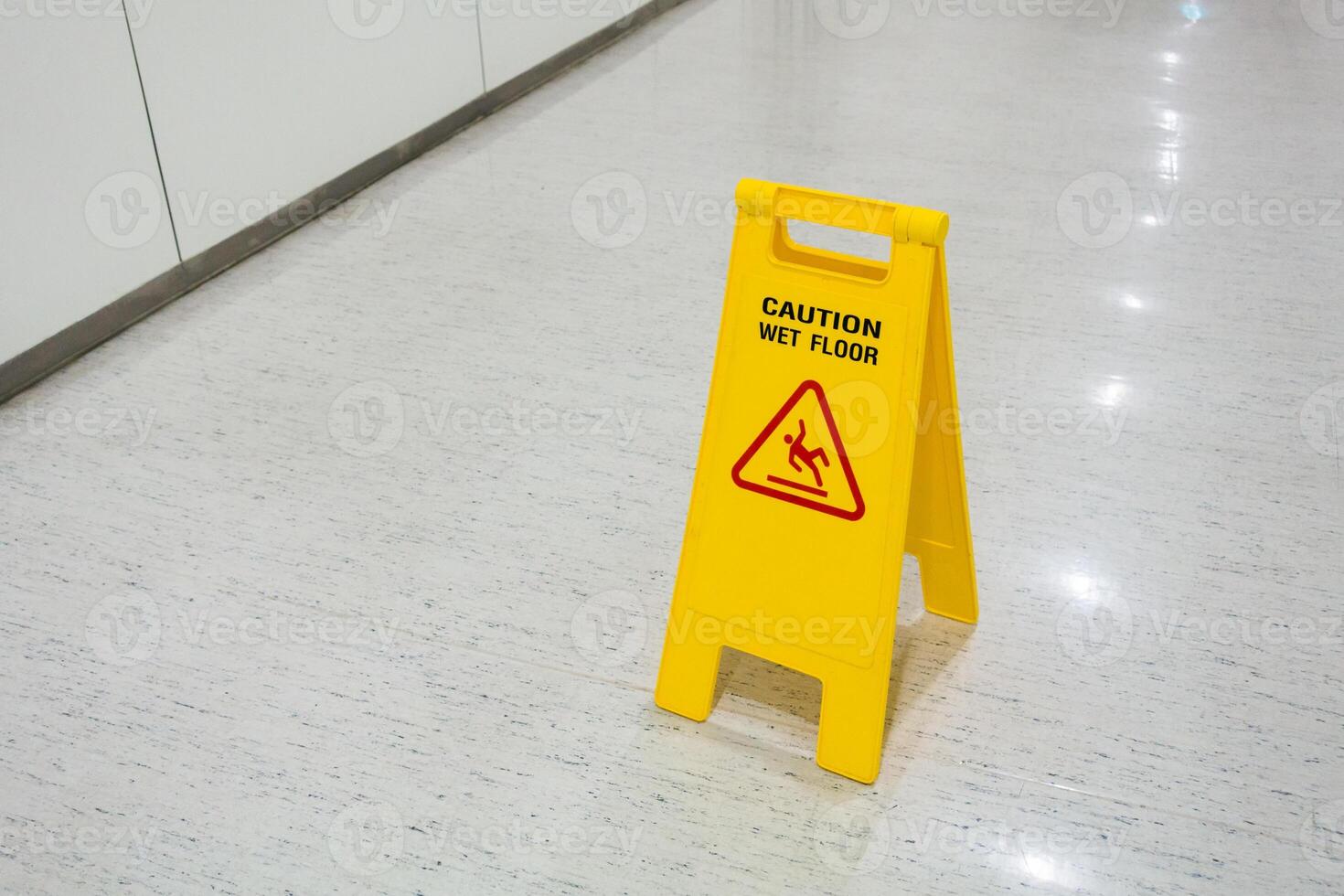 Signs plastic yellow put on floor text caution wet floor photo