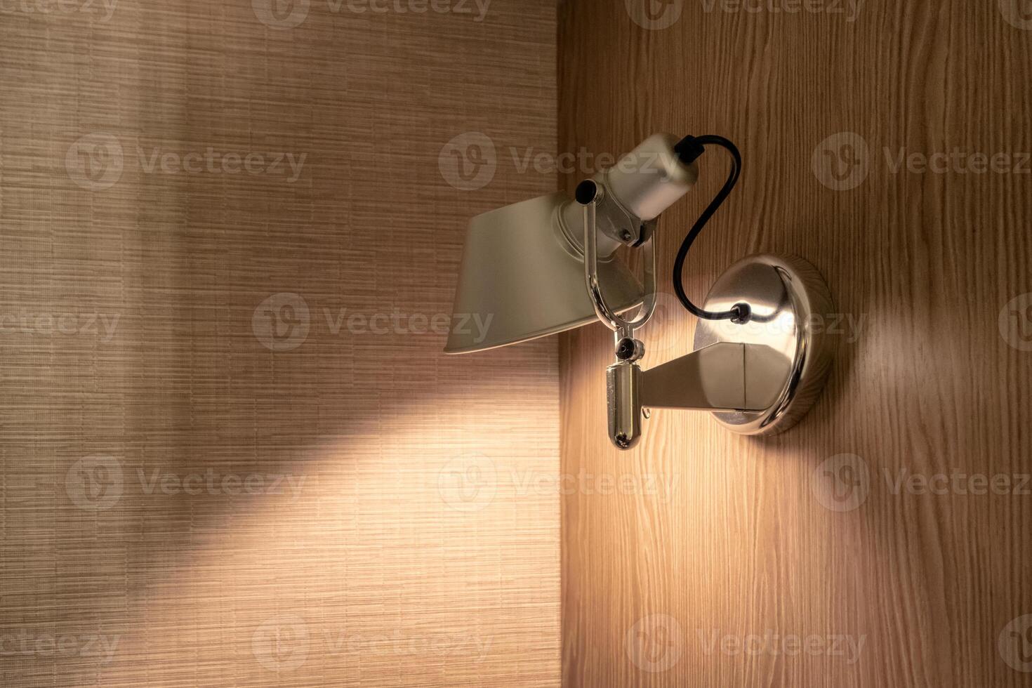 Lamp lighting on corner wooden wall photo