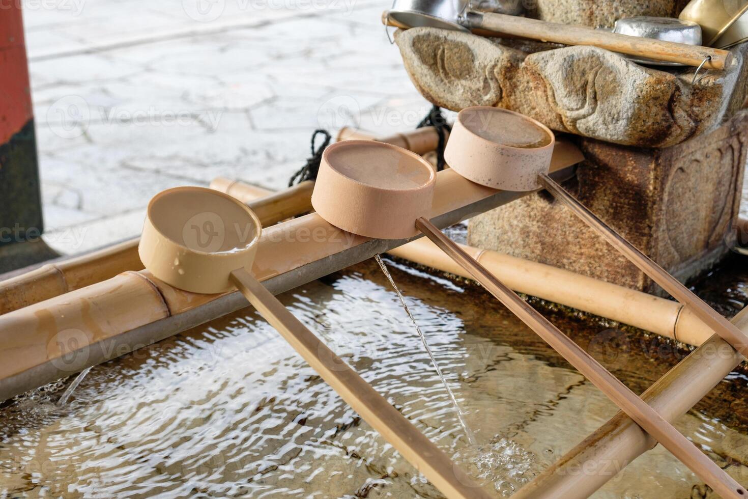 Bamboo dipper put sorted on basin traditional japanese in temple photo