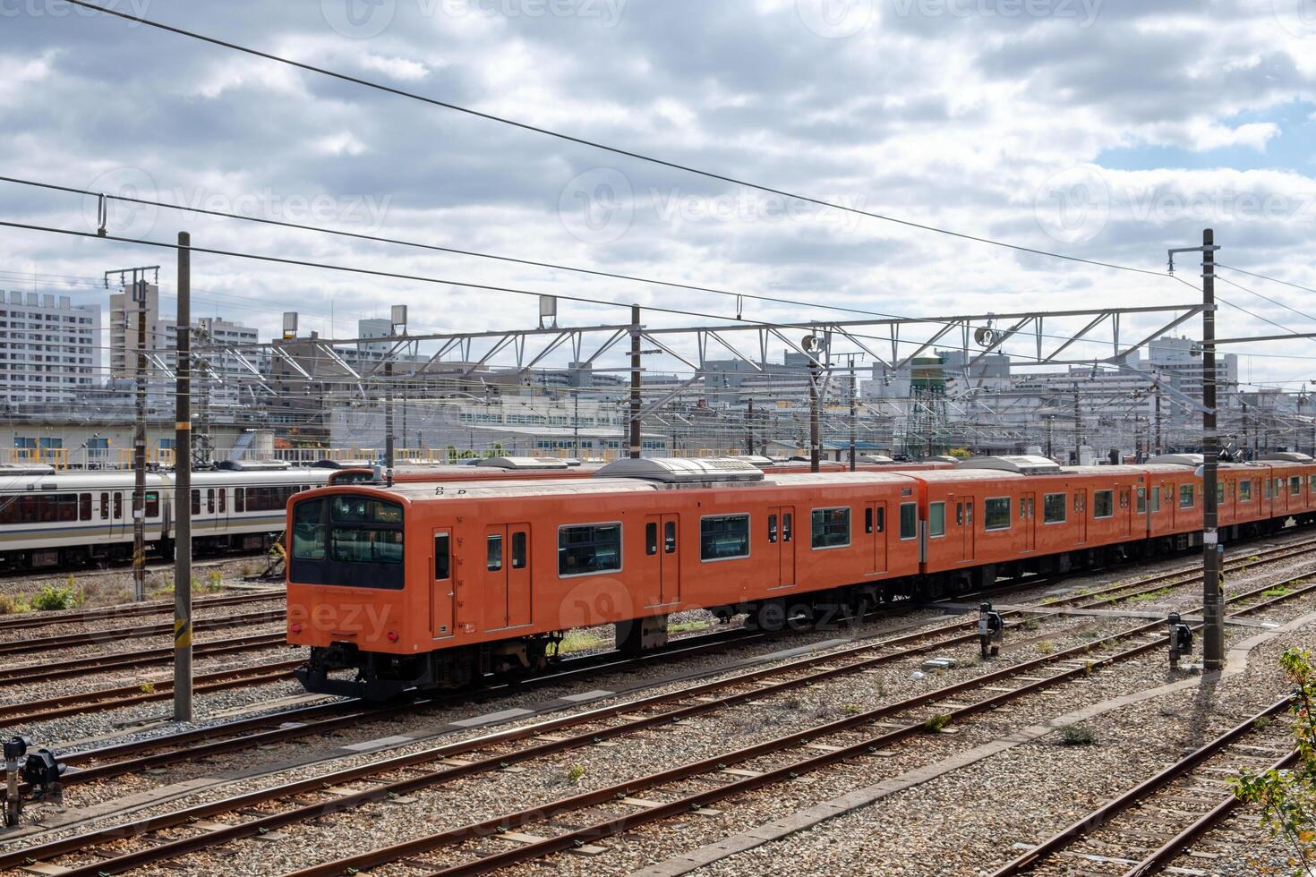 Vintage locomotive orange train in station photo