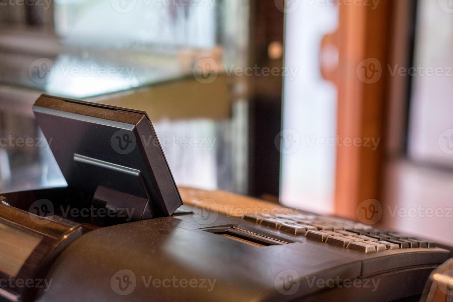 Empty cash register on counter photo