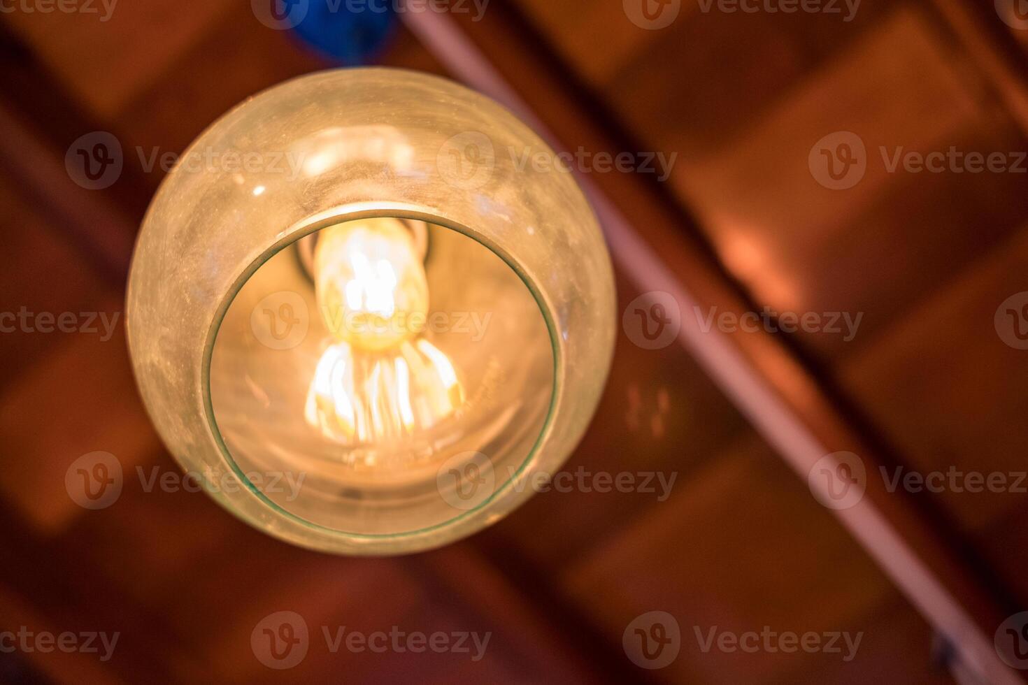 Retro lamp light decorative hanging on wooden roof photo