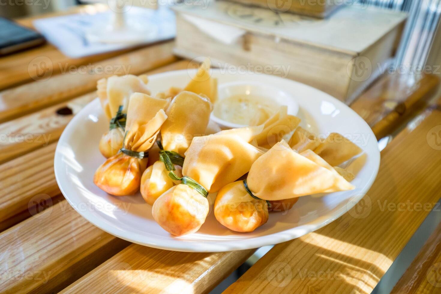 Thai money bag,toong thong,fried shrimp dumplings with sweet sauce photo