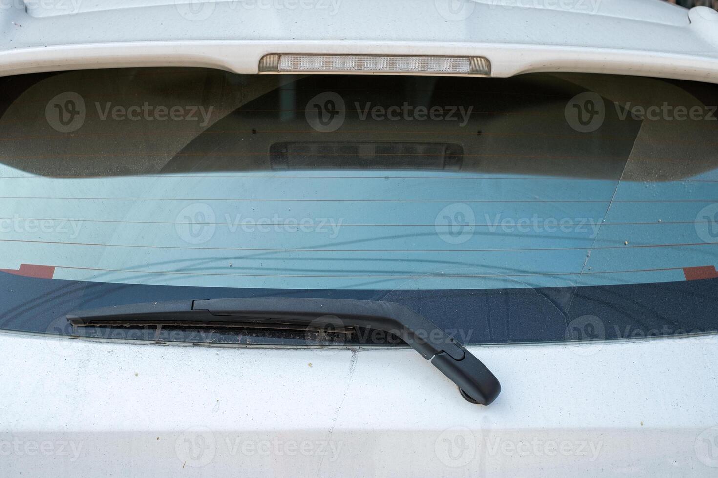 Rear dirt dust eco car with windshield wiper rubber blade photo