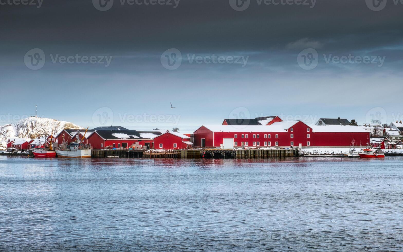 Red warehouse of fishing village industry with on harbor photo