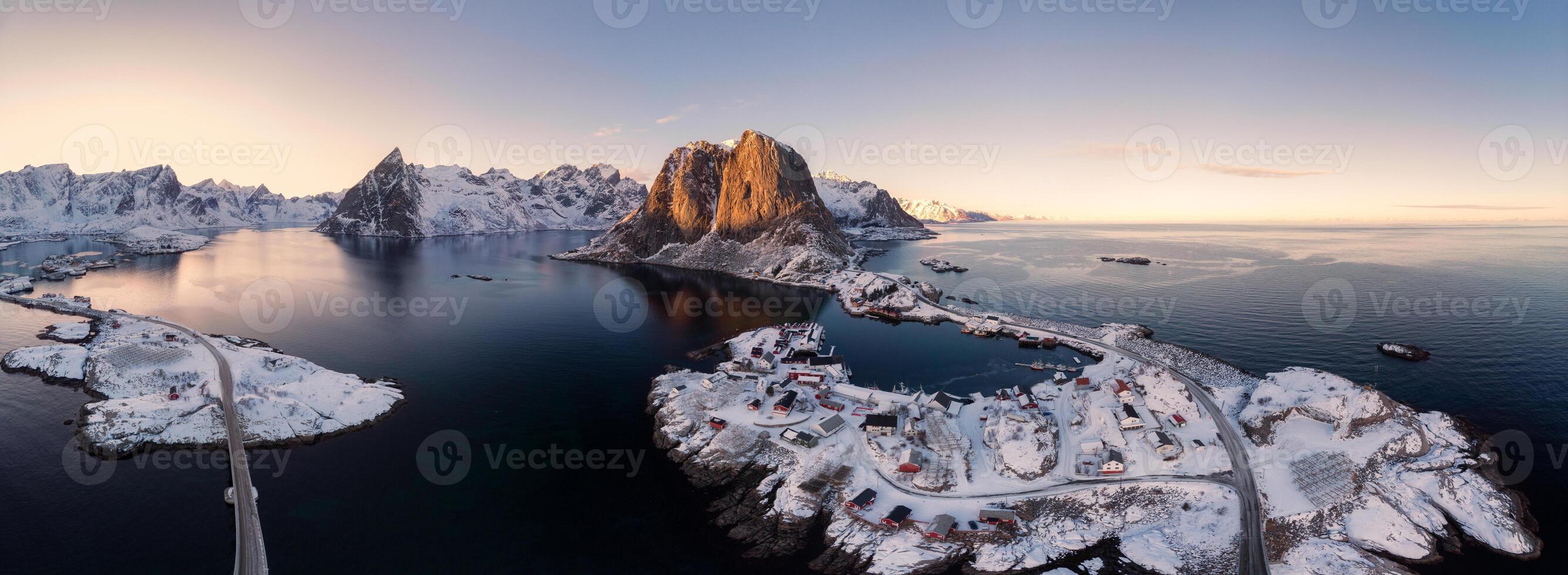 Panorama aerial view of archipelago of arctic ocean with fishing village in winter photo