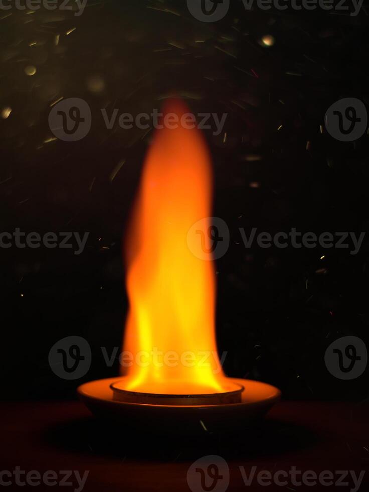 Close up of fire in the dark background photo