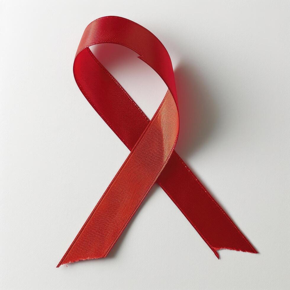 AI generated Red cancer ribbon. Cancer awareness symbol. Isolated on white photo