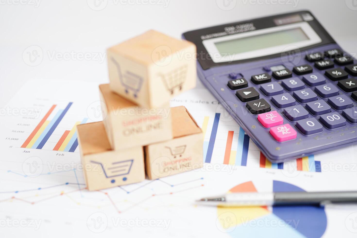 Online shopping, Shopping cart box on business graph, import export, finance commerce. photo