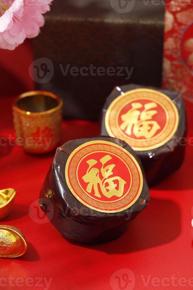 Kue Keranjang or Dodol China in Indonesia. Imlek Red Concept Decoration, CHinese Character is FU mean Prosperity photo