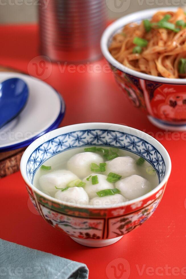 Singapore Fish ball Soup, Clear Soup Broth with White Chewy Fishball photo