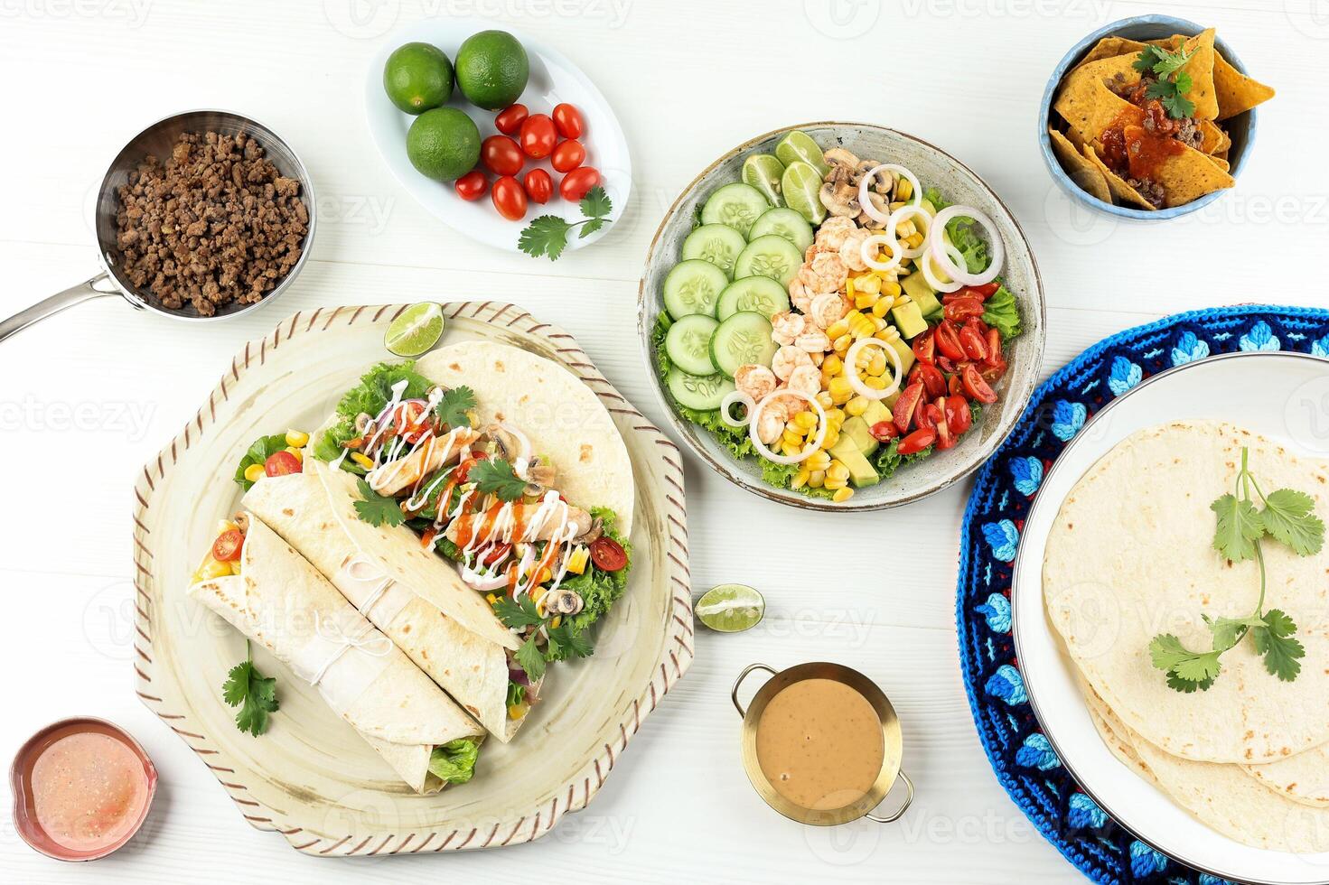 Mexican Food, Chicken Taco Tortilla Wrap, Vegetbale Salad, and Nachos photo