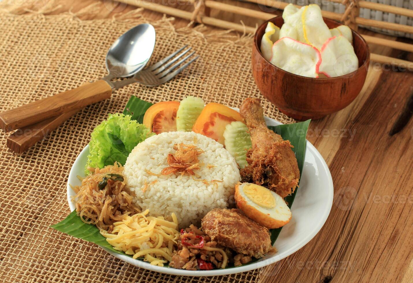 Nasi Uduk Betawi, Steamed Rice Coconut Milk, Seved with Various Side Dish photo