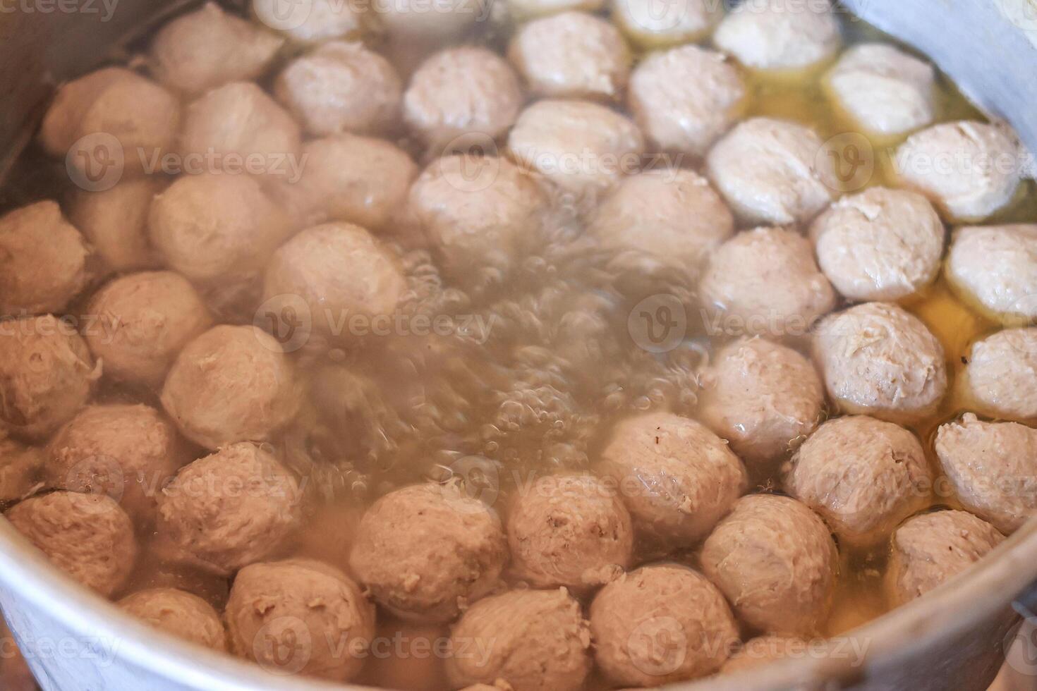 Boiling Bakso Indonesian Meatball in a Pan photo