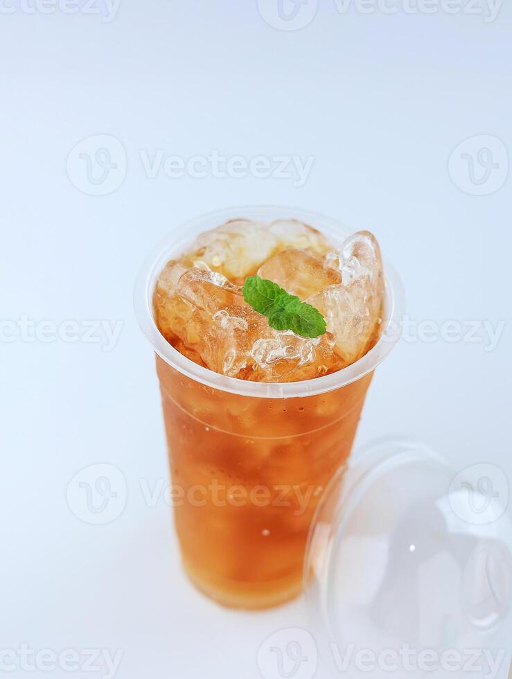 Ice Tea on Plastic Cup with Mint Leaf photo