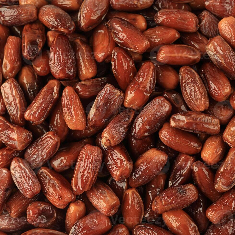 Pile of Shiny Appetizing Dried Date Tunisian Fruits photo