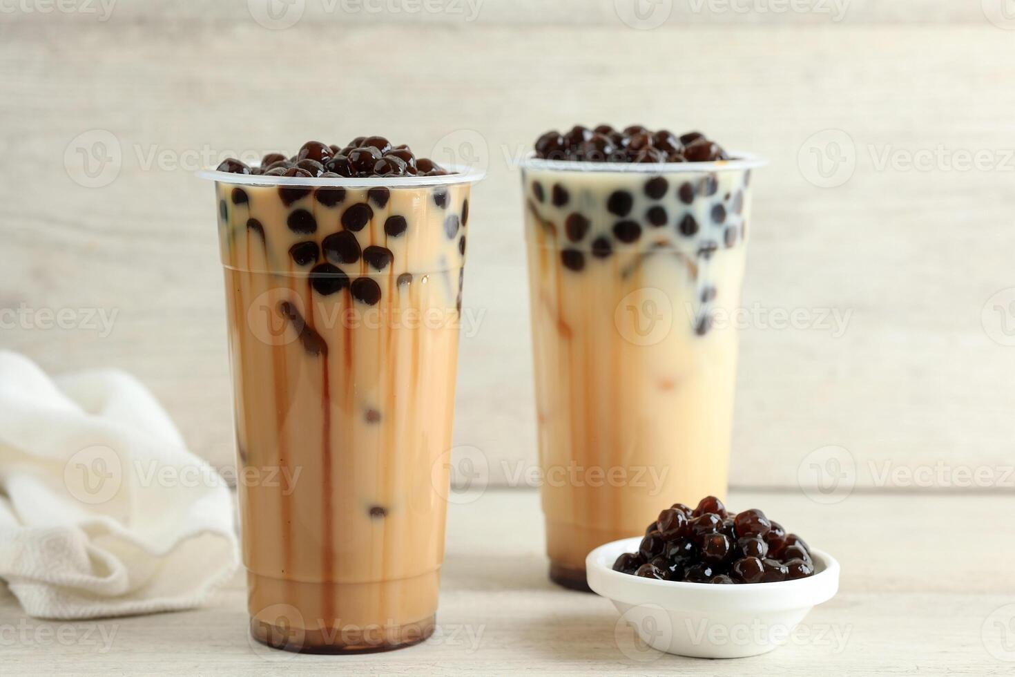 Taiwan Milk Tea with Boba Bubble Pearl on Plastic Disposable Cup photo