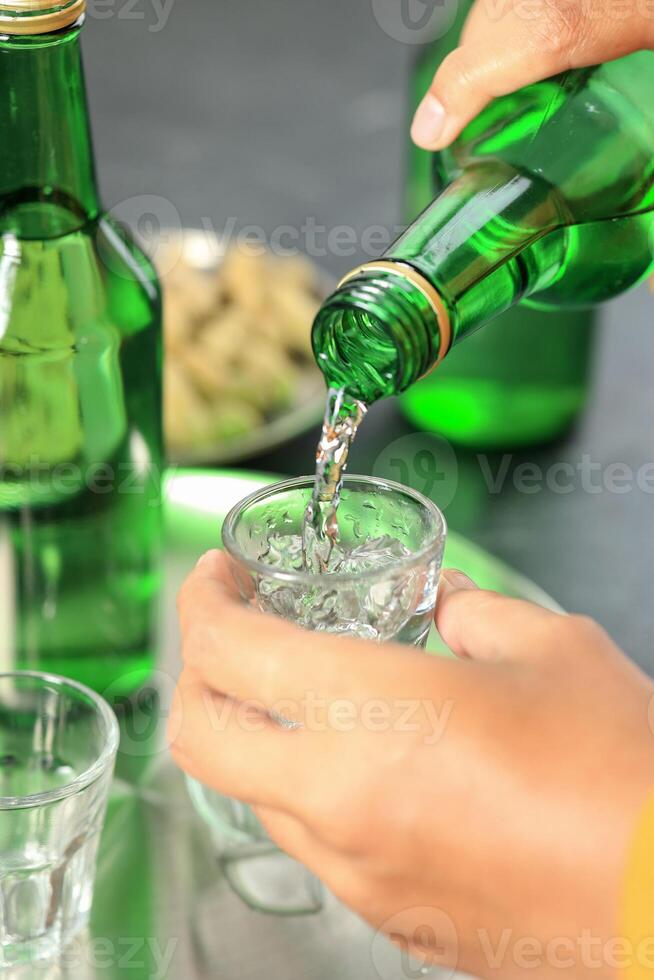 Close Up Pouring Soju to the Sloki photo