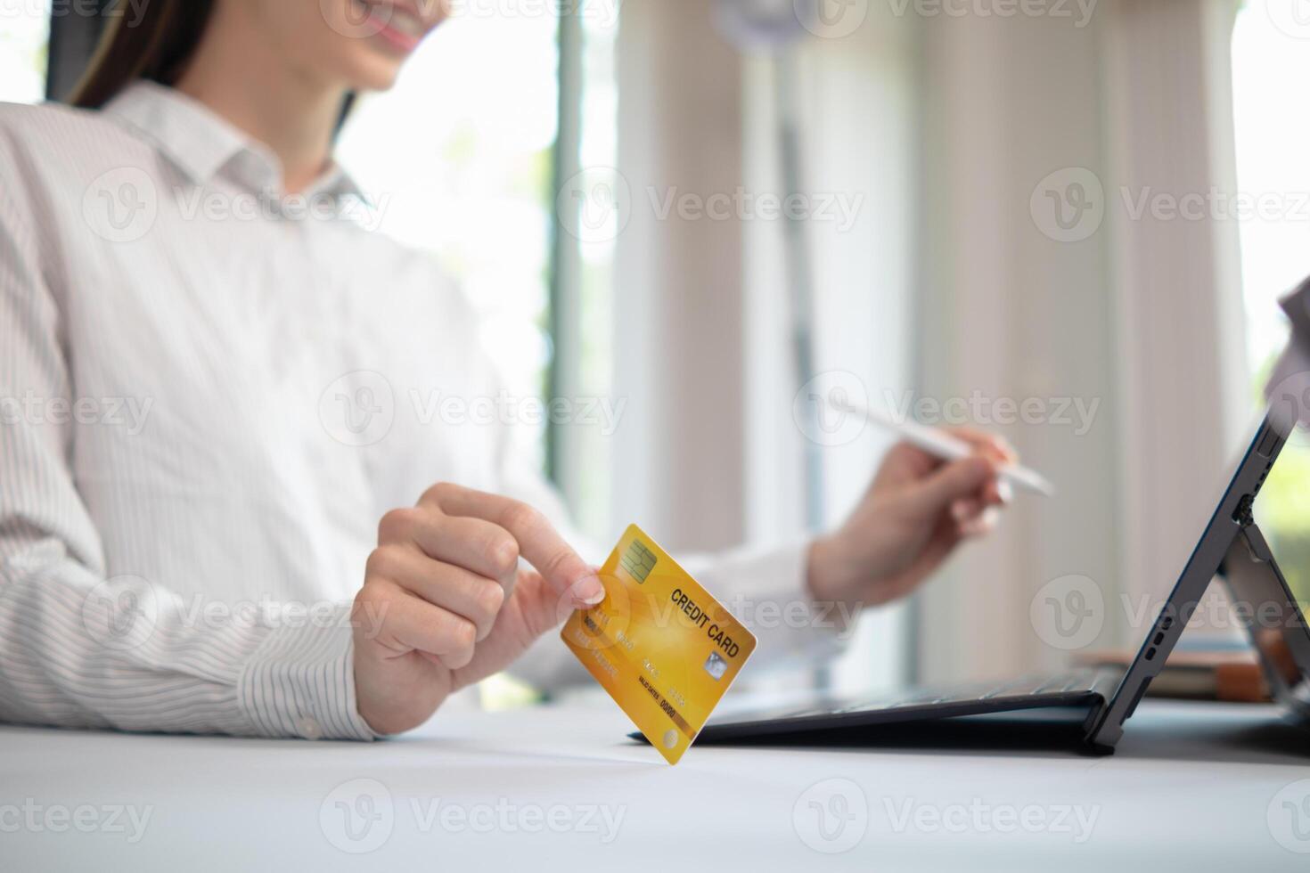 business woman is using credit card to pay for products online when ordering products from store through an online website because using credit card to pay for products brings convenience in shopping photo