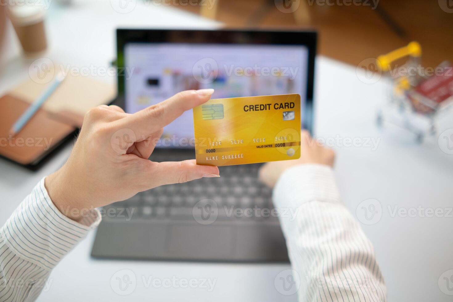business woman is using credit card to pay for products online when ordering products from store through an online website because using credit card to pay for products brings convenience in shopping photo