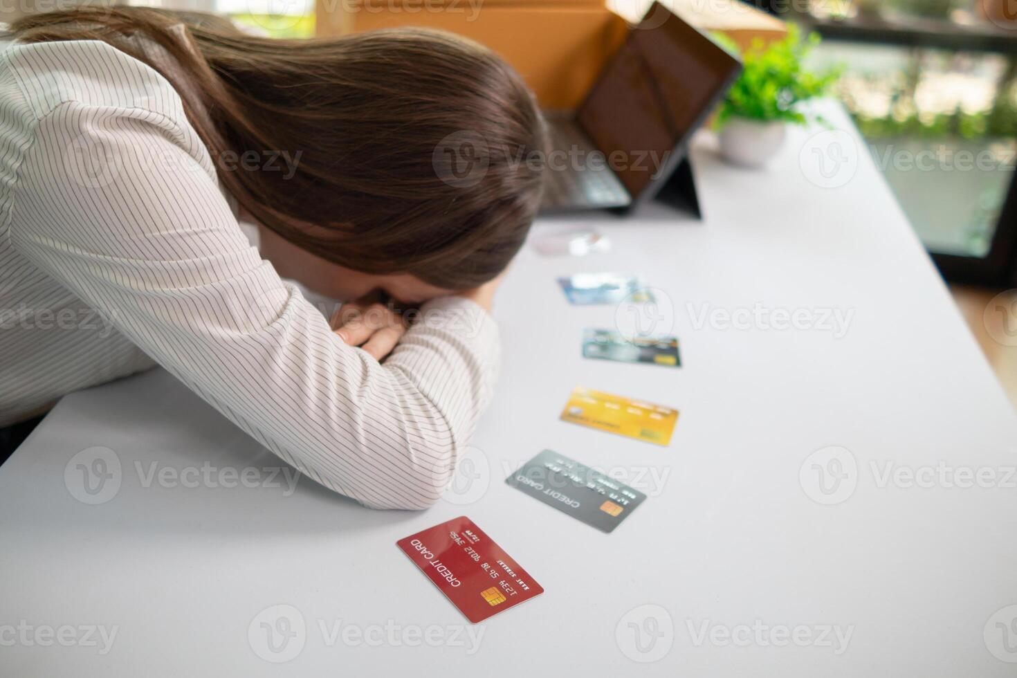 young businesswoman is distraught after exceeding her credit card limit and is being sued by the credit card company for payment plus interest and fines as per the contract due to default on debt photo