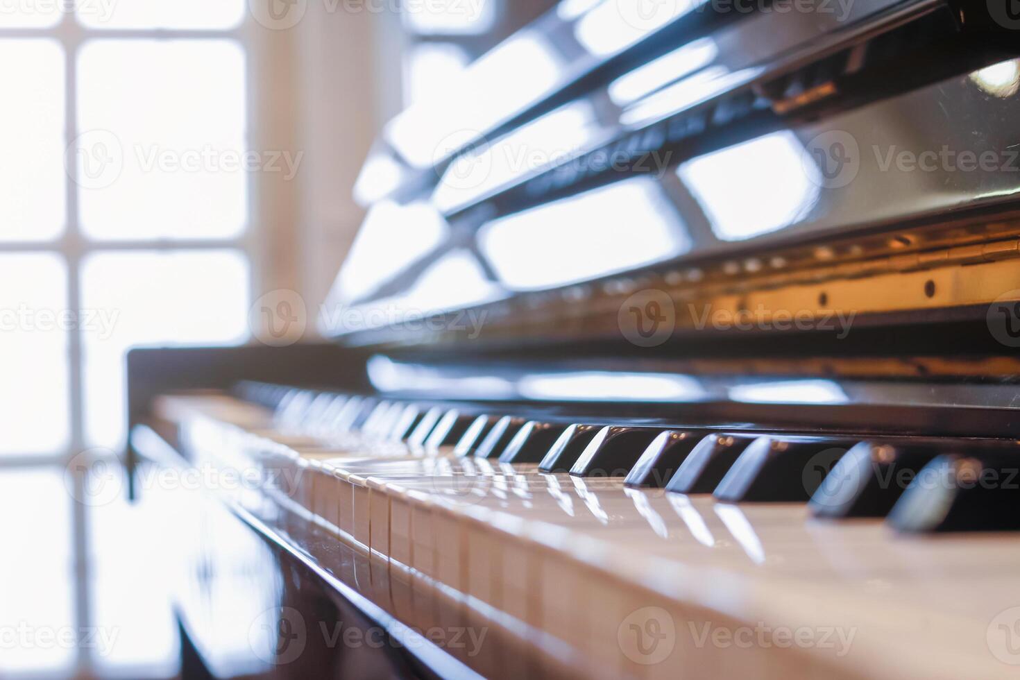 Beautiful piano background are set by the window in the morning waiting for the pianist to come to practice in the morning to reduce the mistake of having to perform the piano performance at a concert photo