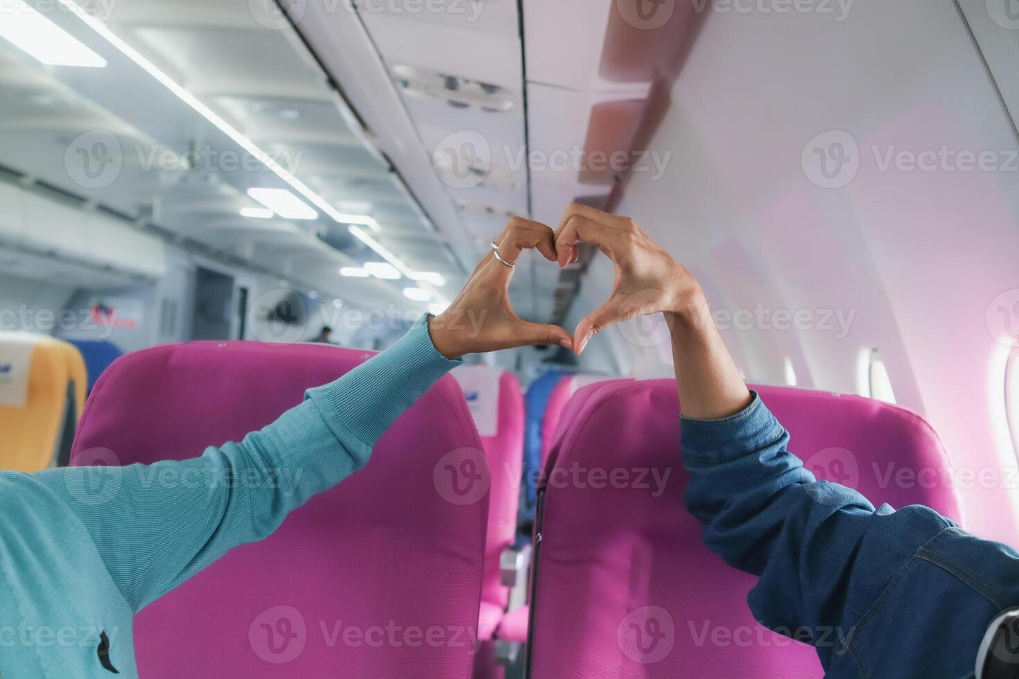 lover raises her hands and makes heart symbol express meaning of love friendship and kindness towards her friend and lover. couple uses their hands to make heart symbol that means love and friendship. photo