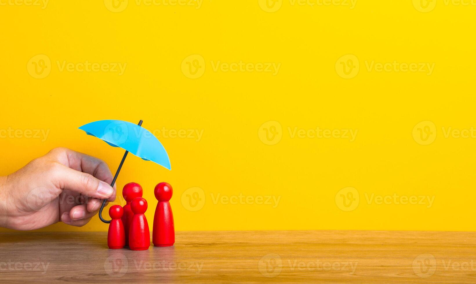 Hand holding umbrella and cover family. photo