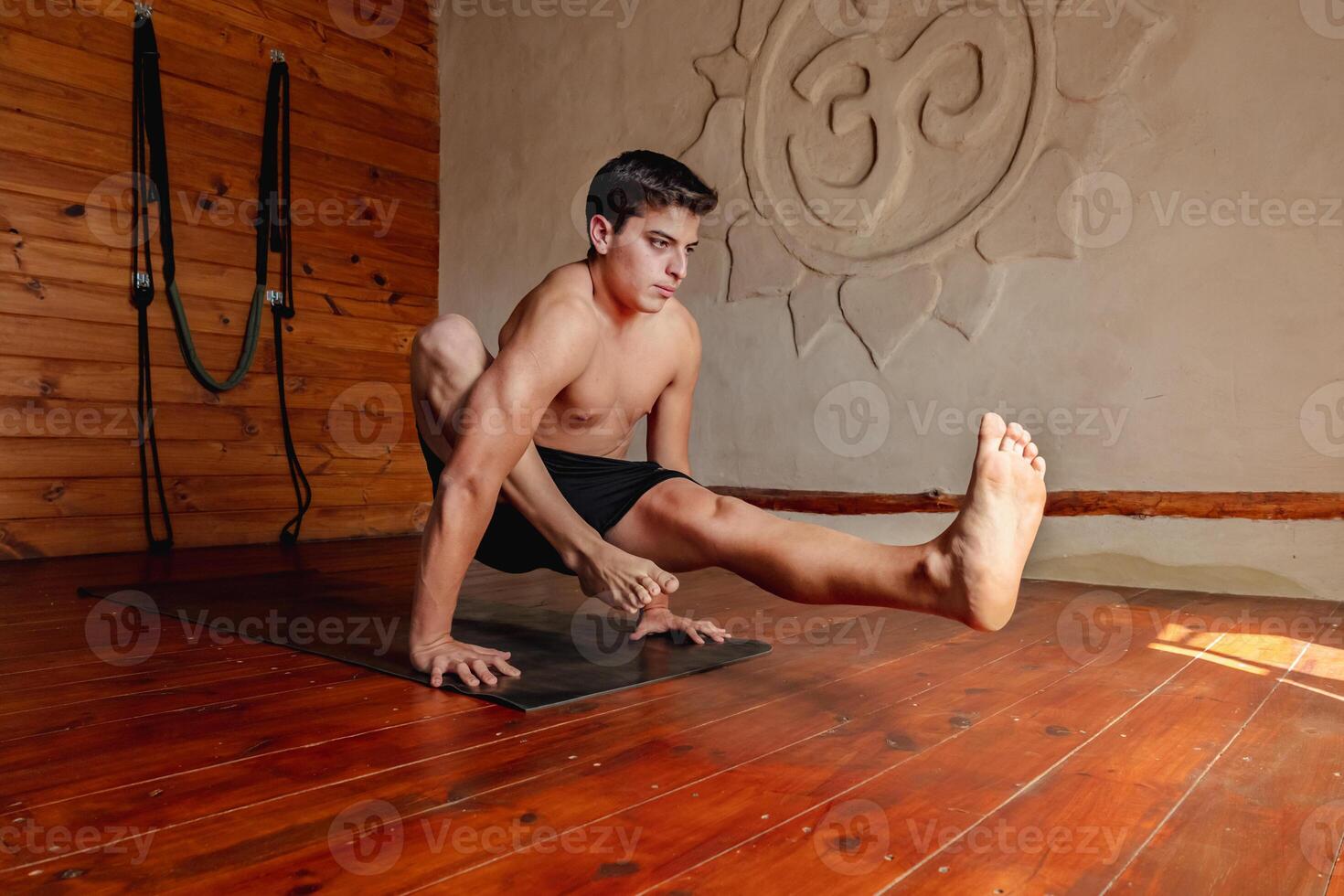 Young man doing yoga asana, lifestyle healthy concept. photo