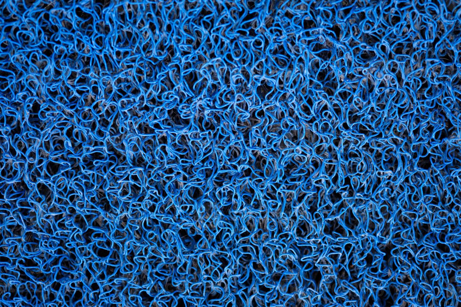 Blue vinyl curl carpet or floor mat background photo