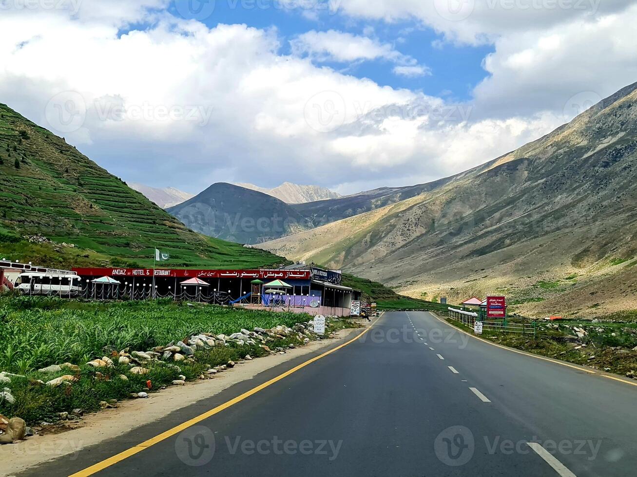 carpeted road in mountains hills photo