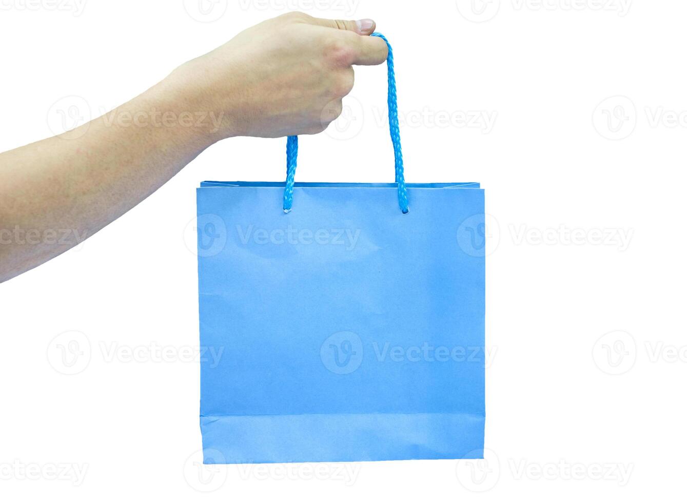 Hand reach blue paper bag on background photo
