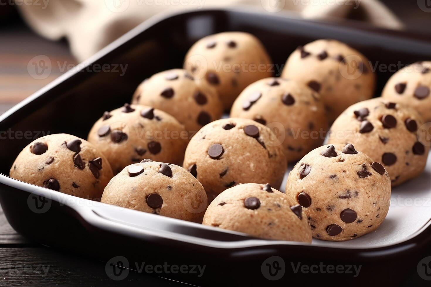 ai generado horneando pan con crudo chocolate chip Galleta pelotas en mesa, de cerca foto