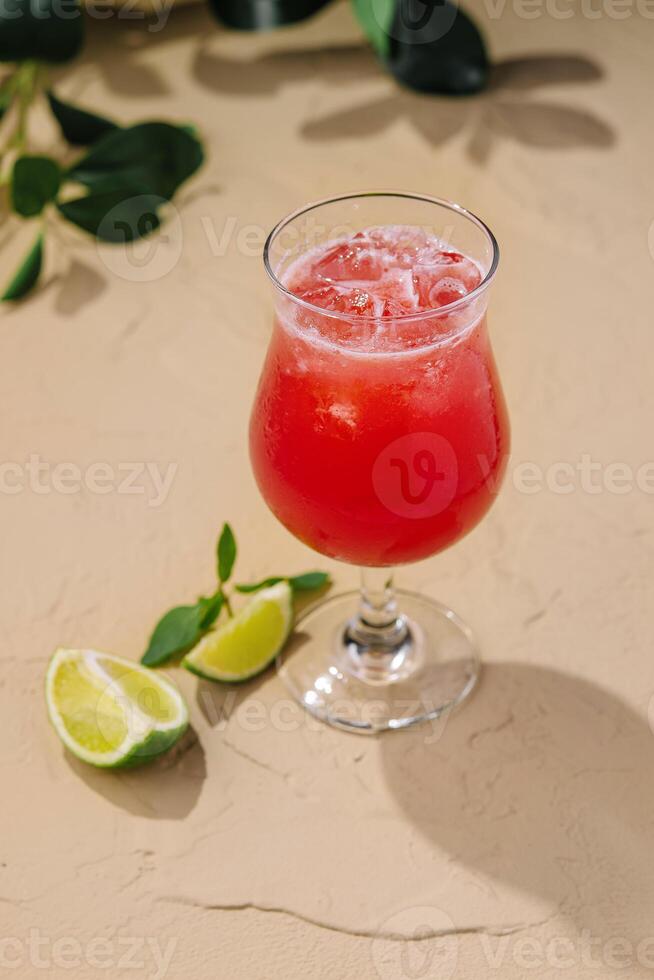 Cold summer strawberry cocktail with lime photo