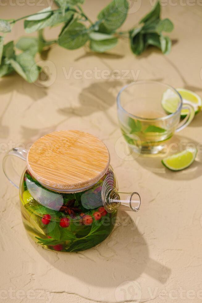 glass jug of green tea and lime photo