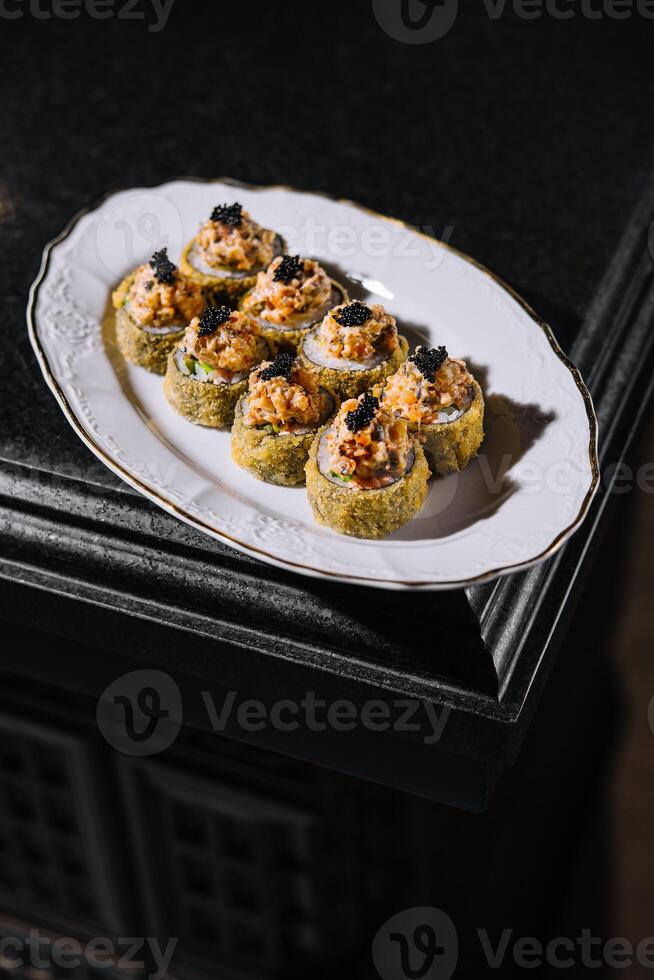 Warm sushi rolls with tempura cream cheese photo