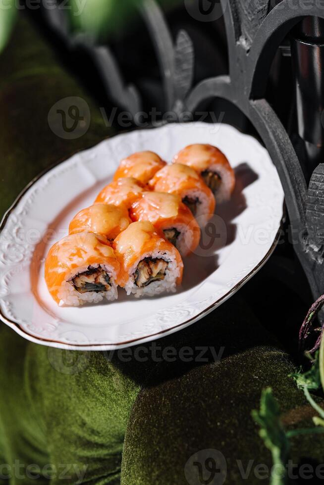 Salmon Fried sushi roll with eel and cheese photo