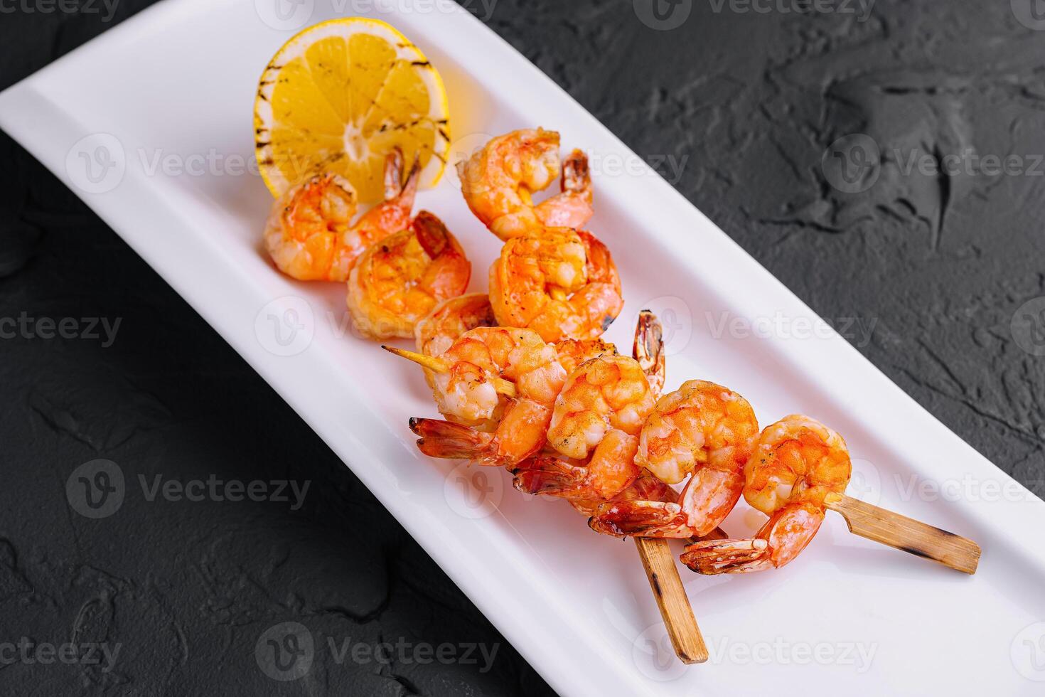 Grilled Shrimp Scampi Skewers with lemon photo