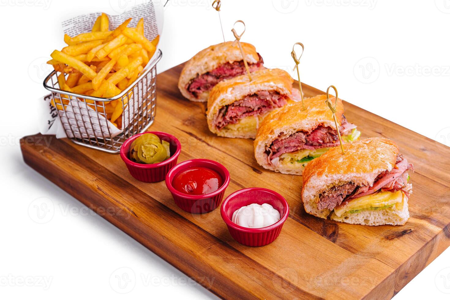 Mini sandwiches with ham and fries with sauces photo