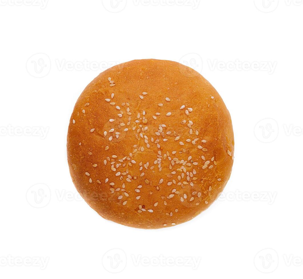 Fresh burger bun with sesame seeds isolated on top view photo