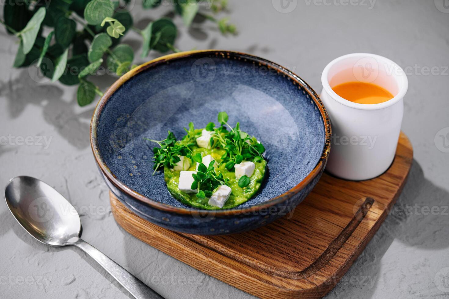 Broccoli, spinach cream soup in a bowl photo