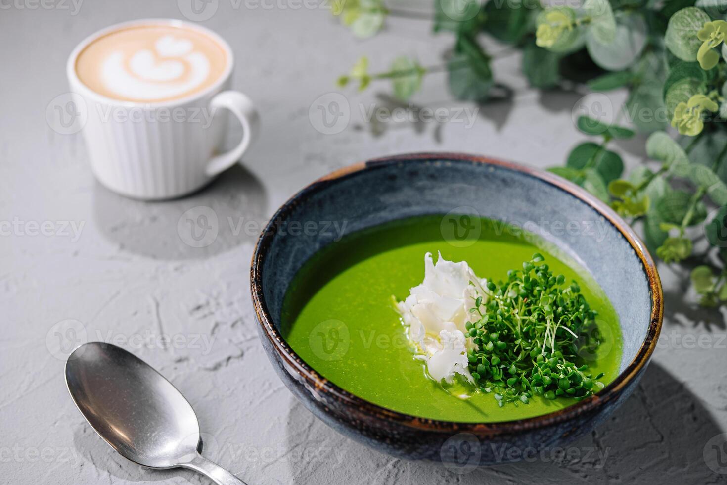 Broccoli, spinach cream soup in a bowl photo