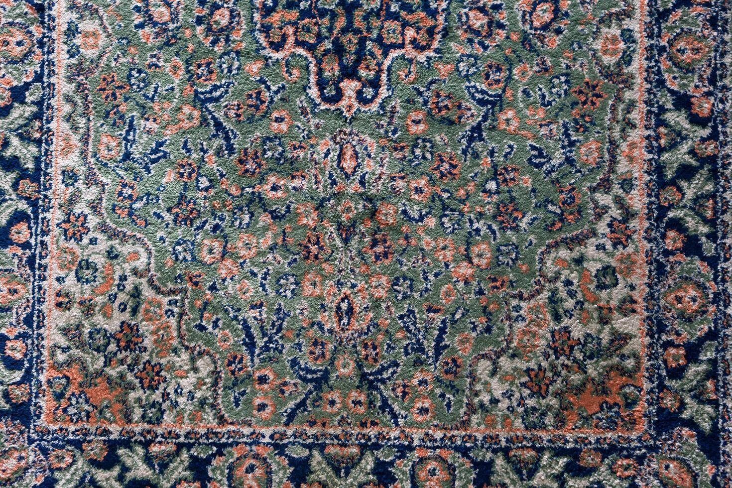 Close up textures background and patterns in color from woven carpets. Traditional wool Turkish rug. Handmade and decorative. photo