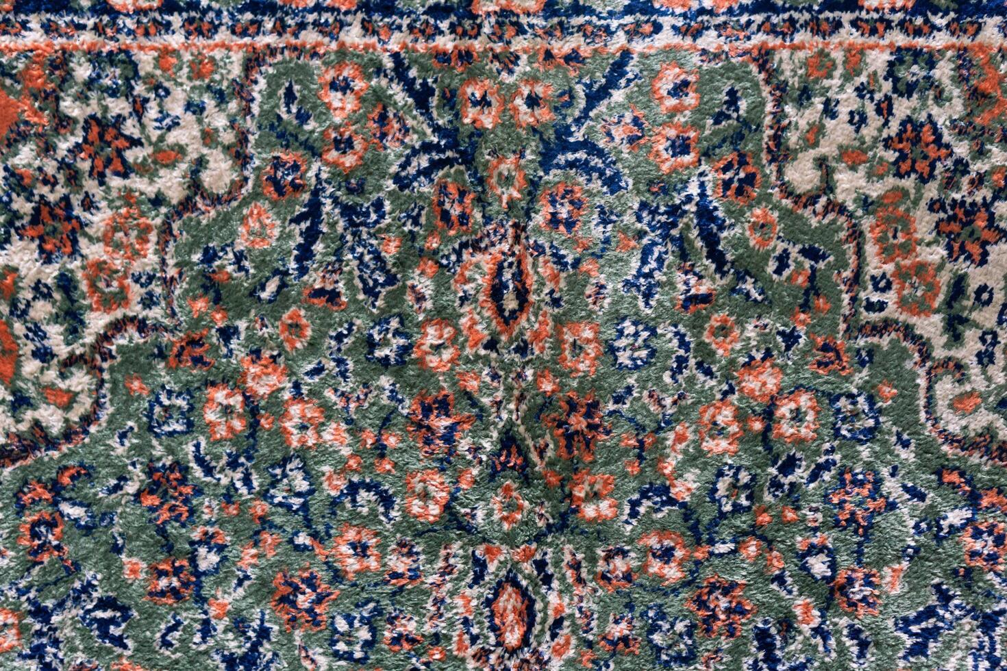 Close up textures background and patterns in color from woven carpets. Traditional wool Turkish rug. Handmade and decorative. photo