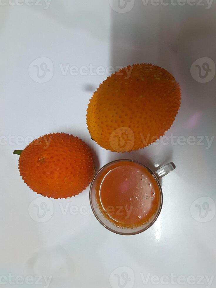Gac fruit orange color background photo