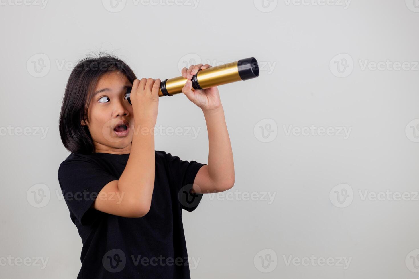 Happy Little Asian girls looking ahead and smiling child with the binoculars. Travel and adventure concept. Freedom, vacation photo