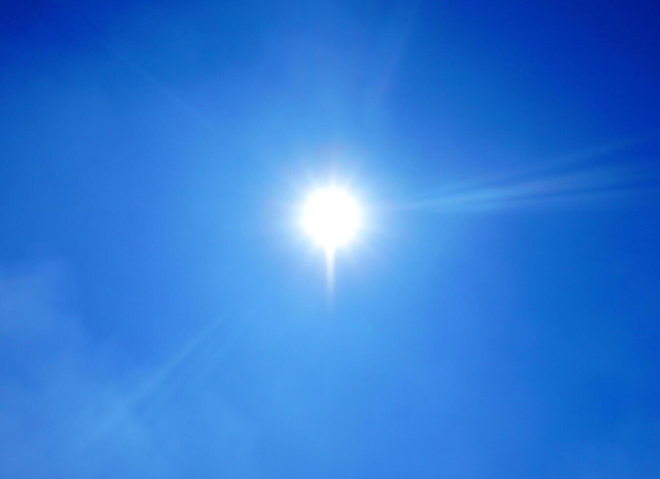 Clouds in the blue sky with sunny background. Blue sky with white clouds Bright sun background. photo