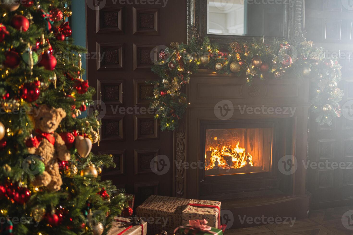 Classical Christmas decorated interior living room library with fireplace. Christmas tree with red golden ornament decorations. Modern classic style interior design apartment. Christmas eve at home photo